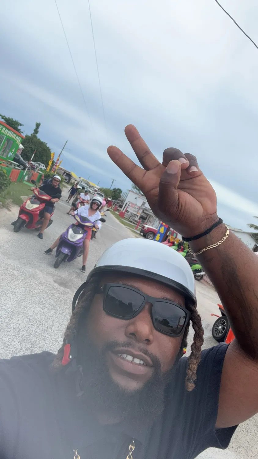Captain Teno leading guests on an island scooter tour
